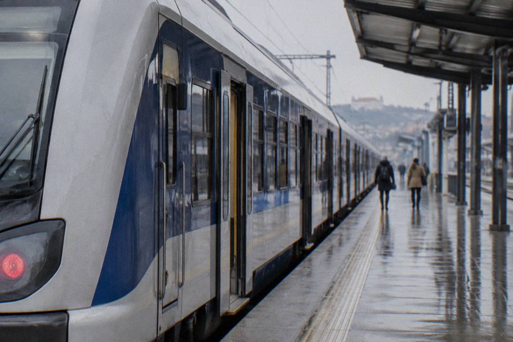 Train standing at a platform in a Central European railway station