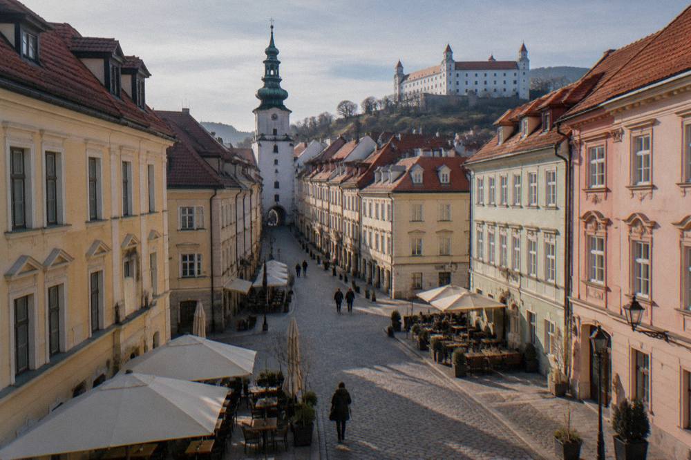 Pedestrian square in Bratislava old town with colourful facades and outdoor tables