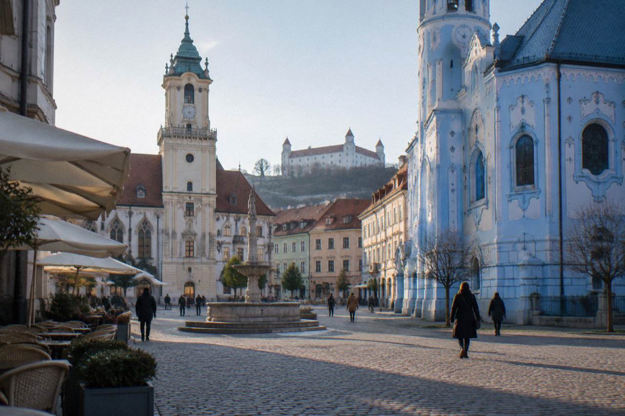 The blue and white facade of the Church of St Elizabeth in Bratislava seen from the street