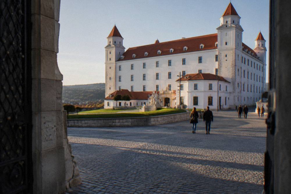 The square courtyard of Bratislava Castle seen from the entrance gateway