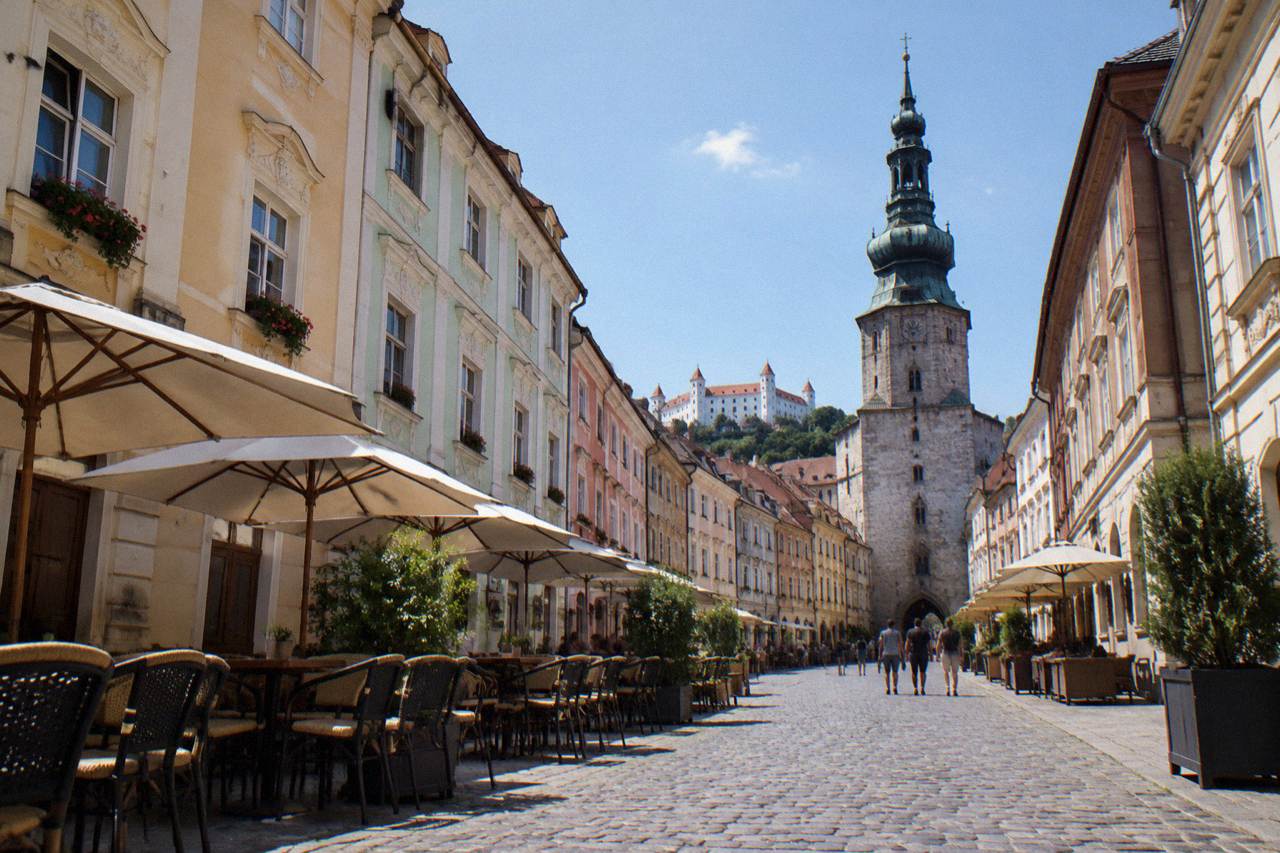 Narrow Old Town lane with pale facades