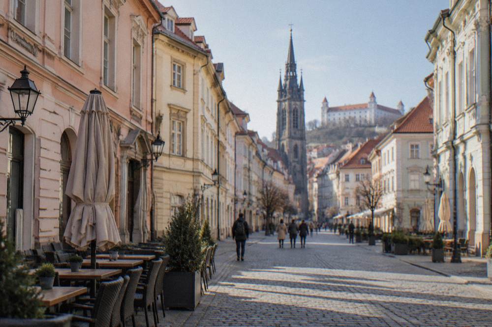 Pastel-coloured townhouses framing the Main Square in Bratislava Old Town on a bright day