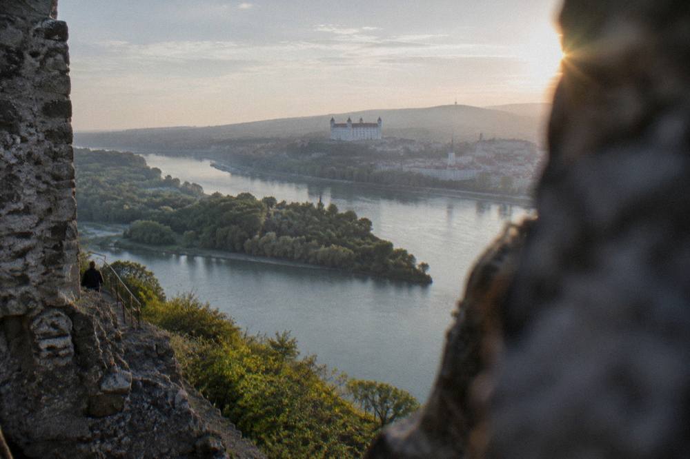 Wide river view from a high vantage point with forested banks on both sides