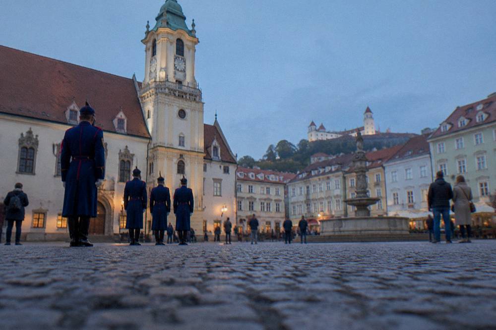 Ceremonial guard and visitors in front of a palace in Bratislava