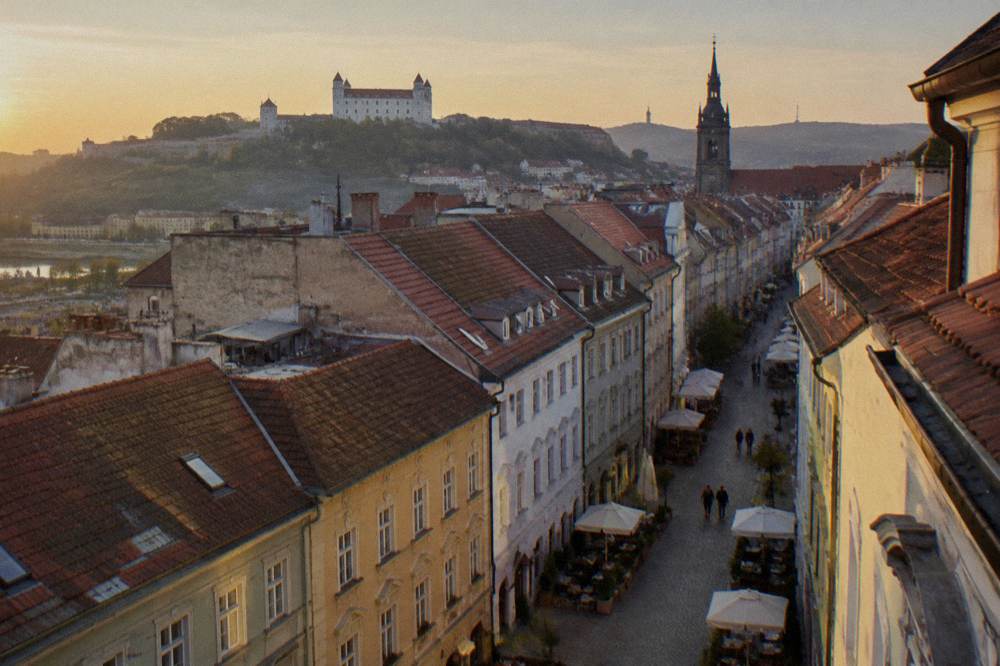 Rooftops of a historic Old Town seen from a high tower viewing level on a clear day