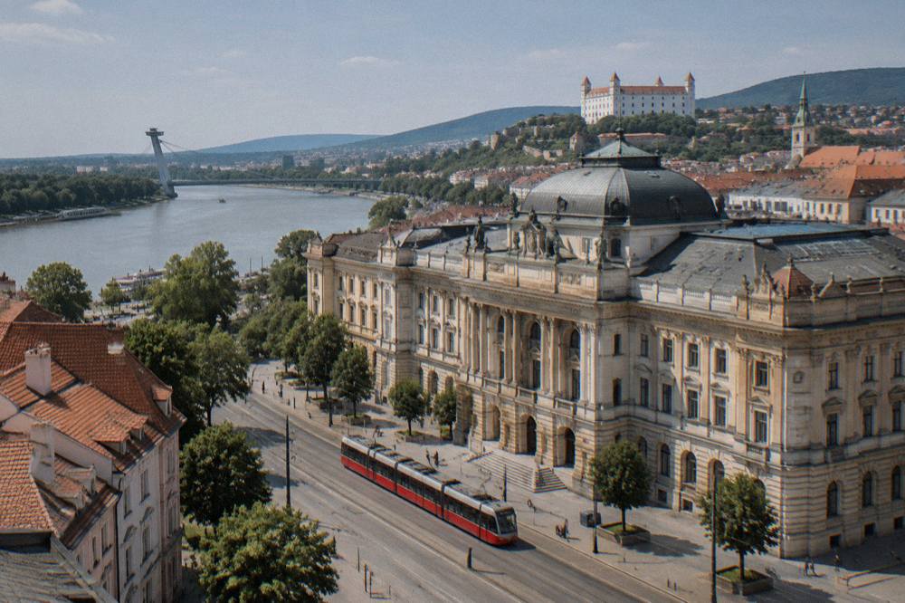 The Danube flowing past the city with the castle hill in the background