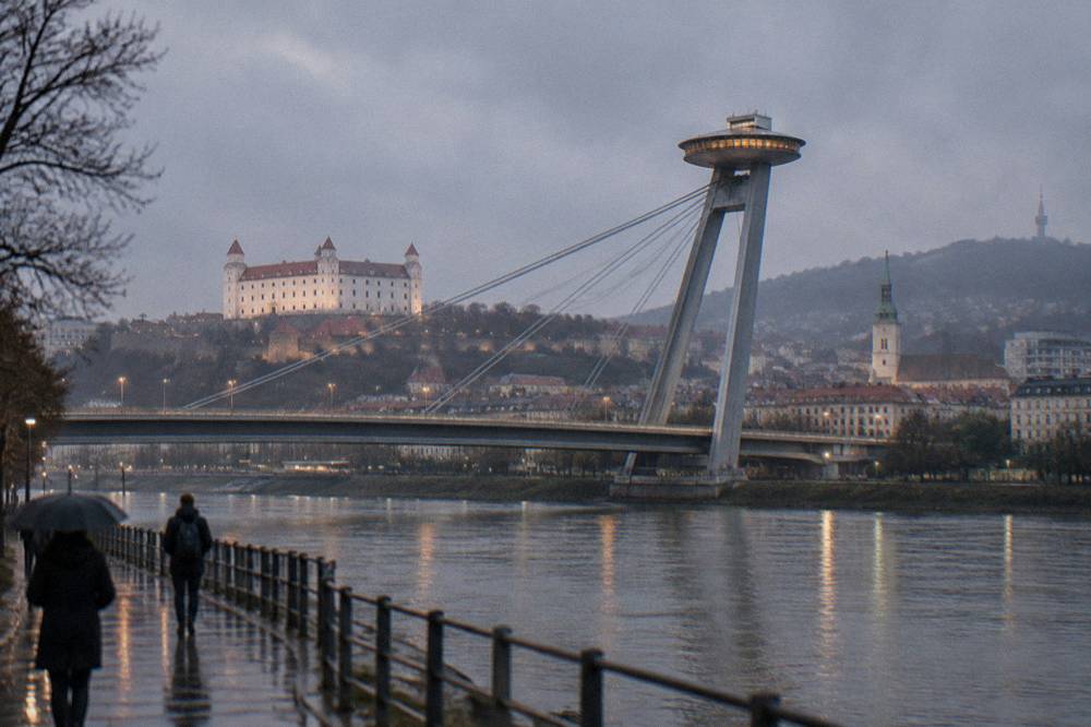 Bridge and tower lit at dusk, Bratislava