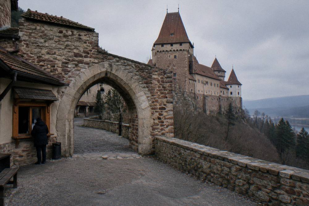 Ticket window and stone archway at a Slovak castle entrance