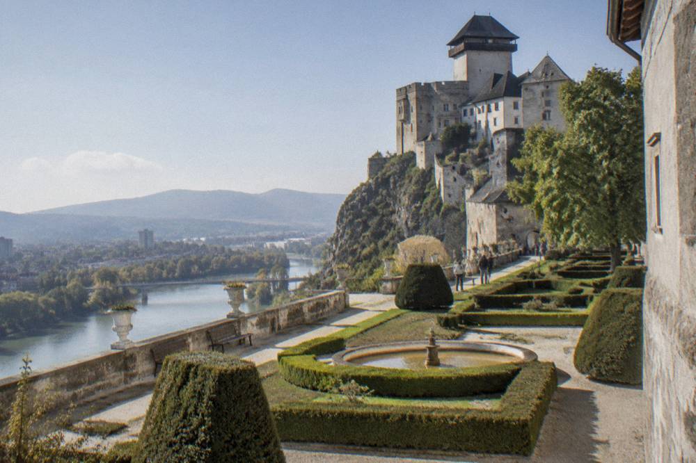 A baroque castle garden with trimmed hedges and gravel paths