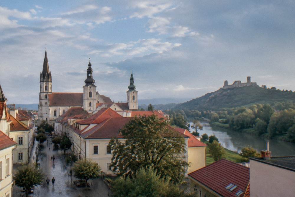 Hilltop castle ruins above a river valley in western Slovakia