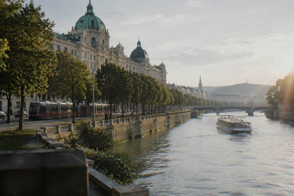 Passenger boat cruising along the Danube between riverbanks