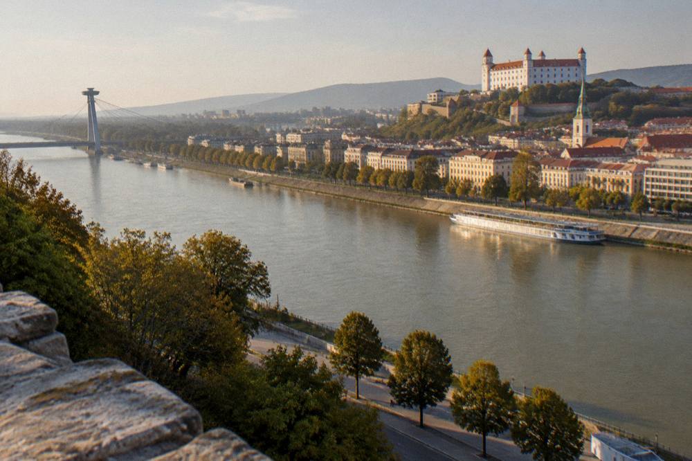 The Danube and the Bratislava riverfront seen from the castle hill in late afternoon light