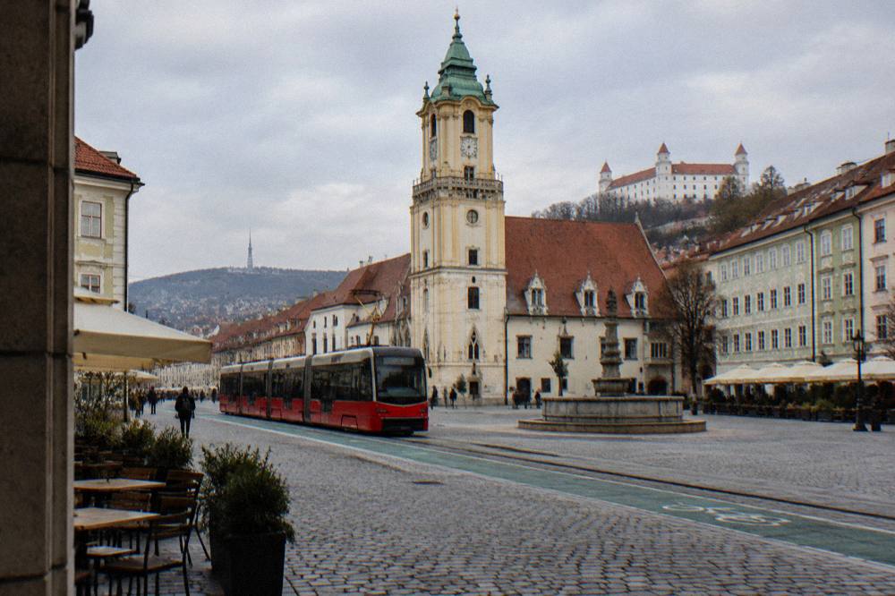 A tram passing a designated bike lane on a city street in Bratislava