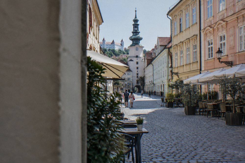 Pastel coloured facades of townhouses on a small square in Bratislava's Old Town