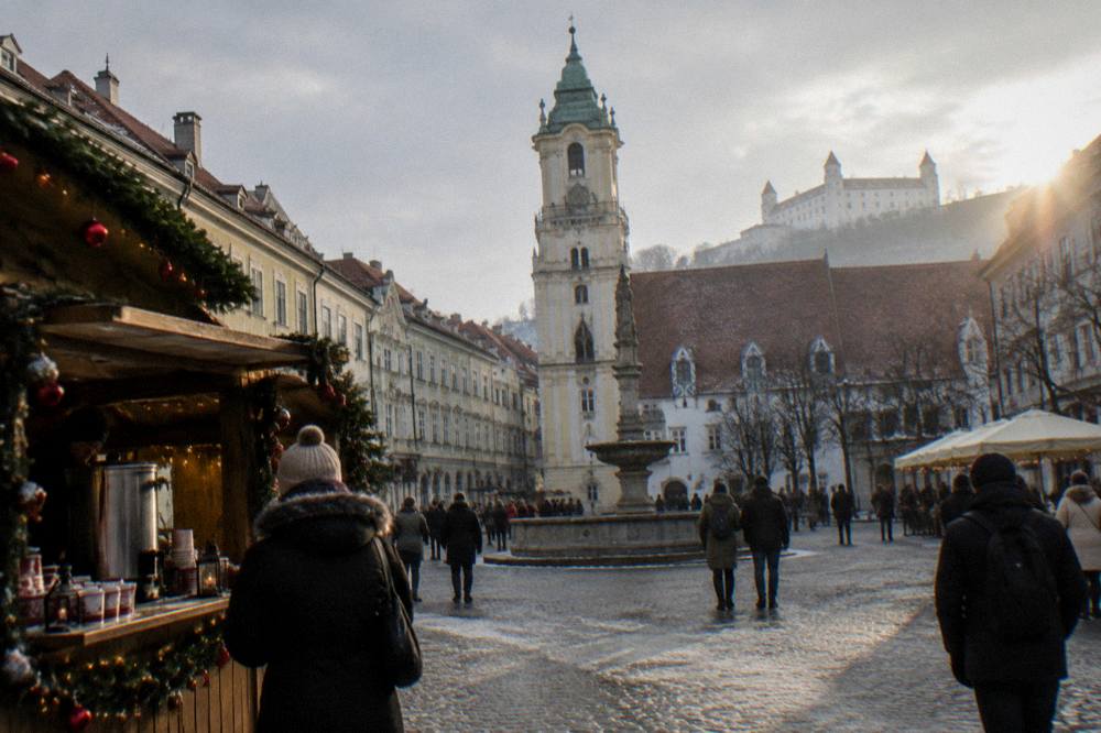A wooden market stall with punch cups and Christmas decorations in Bratislava