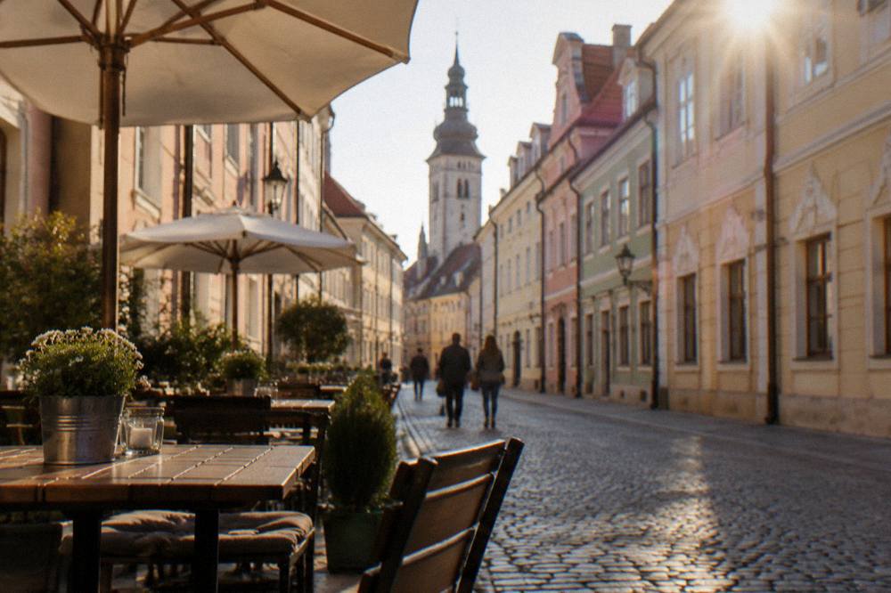 Cobblestone square in Bratislava Old Town with cafe tables and colourful facades