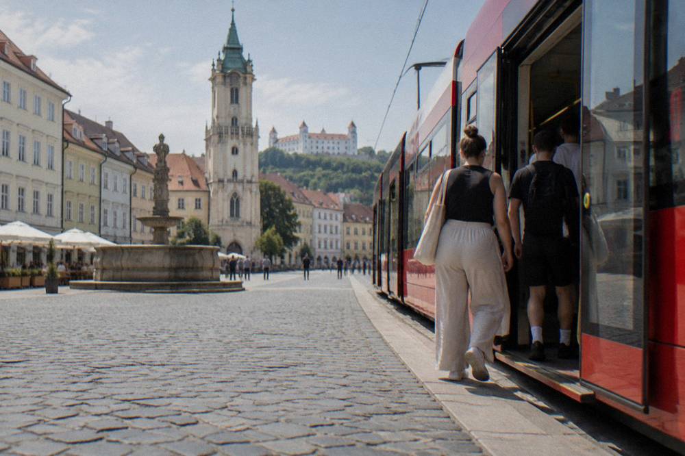 Passengers boarding a tram at a stop in central Bratislava
