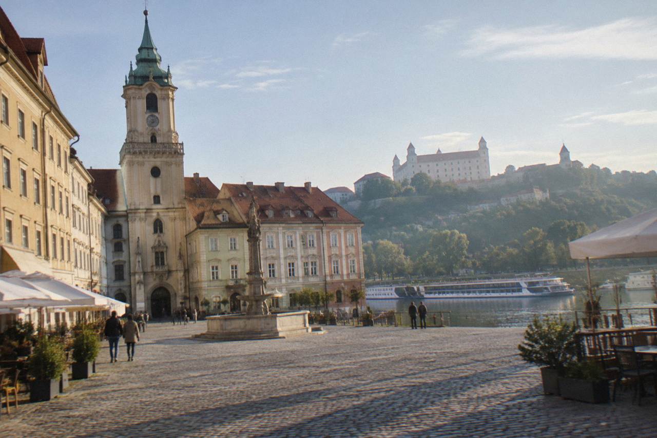 A river boat moored on the Danube in Bratislava with the castle on the hill above the water