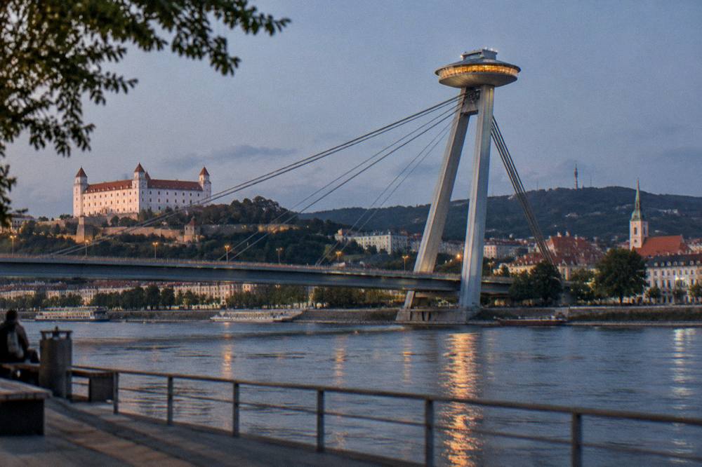 The UFO observation deck on the bridge above the Danube lit up at night