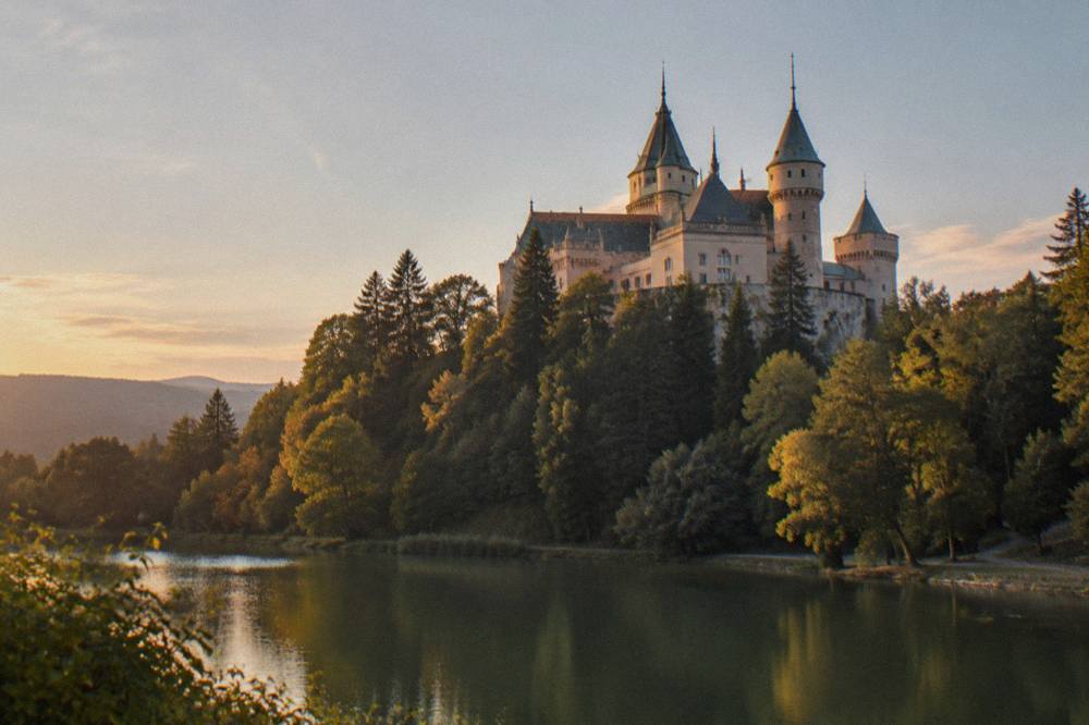 Bojnice Castle above a forested hill in western Slovakia