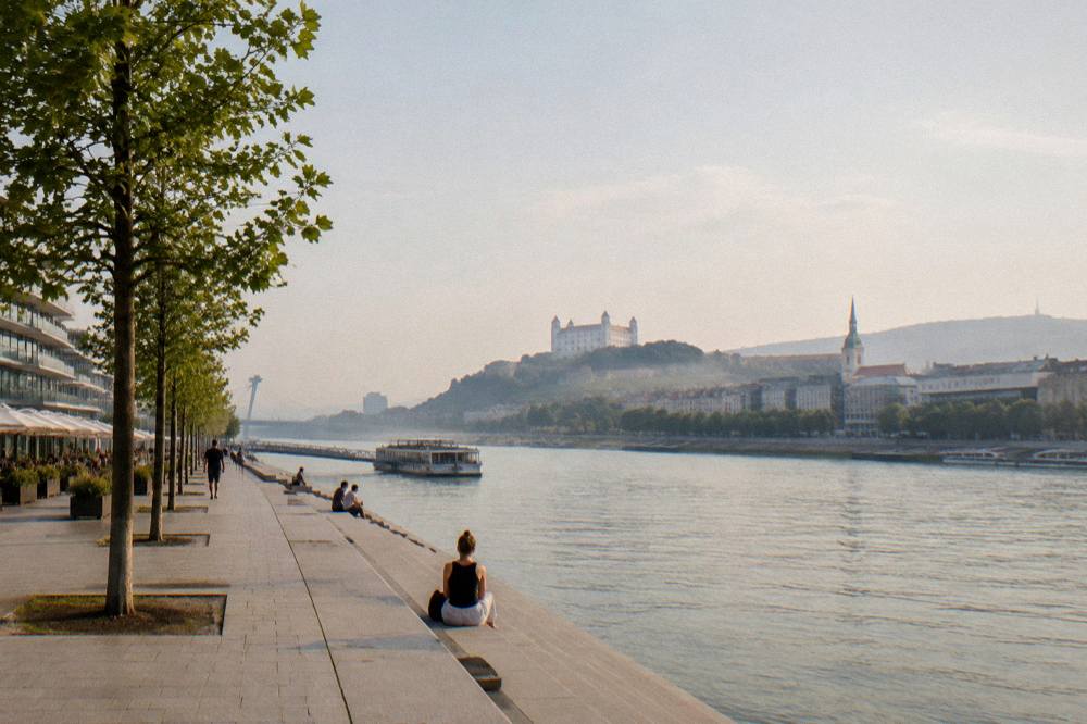 Evening light on the Danube waterfront with the Eurovea promenade in Bratislava