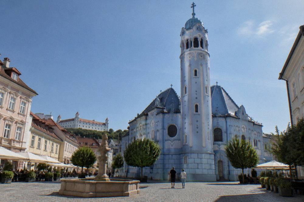 The blue facade and tower of the Church of St Elizabeth in Bratislava on a sunny morning