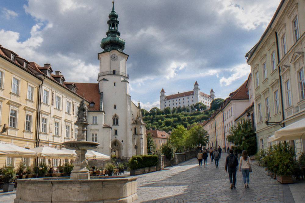 Visitors walking up the path toward Bratislava Castle on Castle Hill