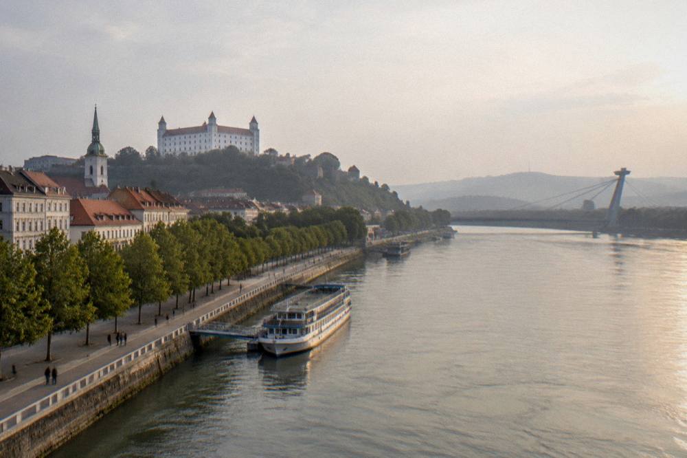 Evening light on the Danube with the castle silhouette above the Bratislava riverfront