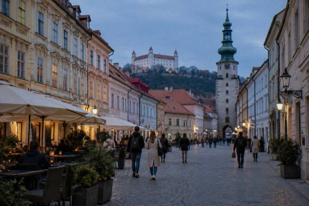 Tourists crossing the Main Square in Bratislava's pedestrian Old Town