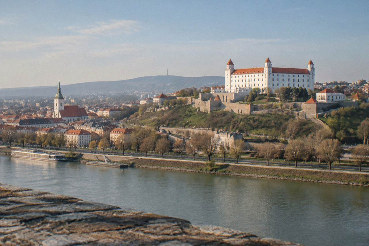 Panoramic view of Bratislava Castle above the Danube river and the Old Town rooftops