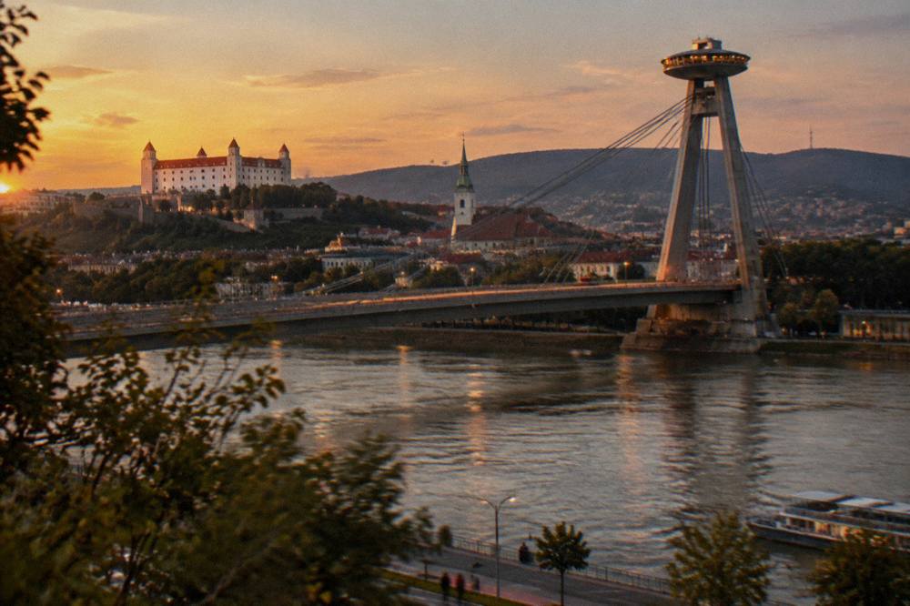 Evening view of the illuminated UFO observation deck on the Most SNP bridge over the Danube