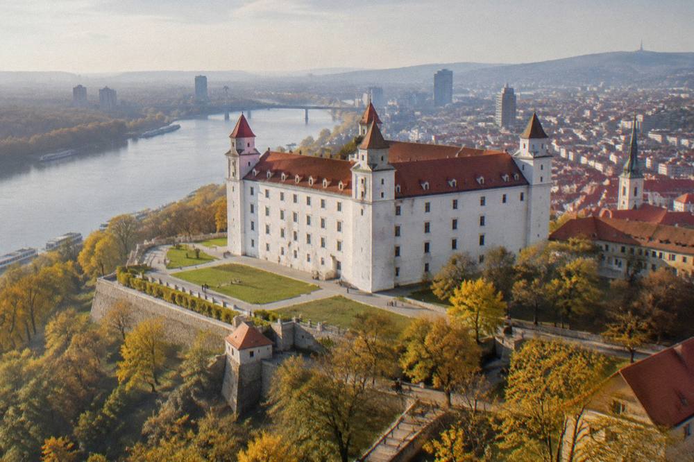 Autumn light over Bratislava Castle hill with the city skyline behind